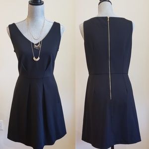 Black V-neck sleeveless dress with pockets